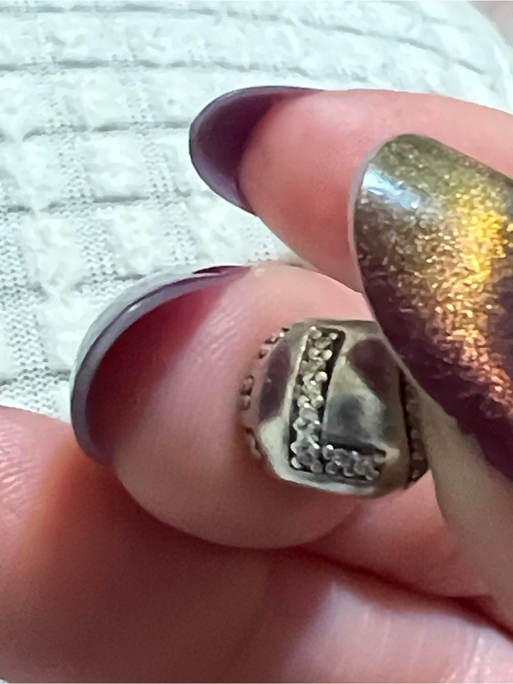 Vintage LOVE charm from Pandora.  Has a pink bling in the letters.